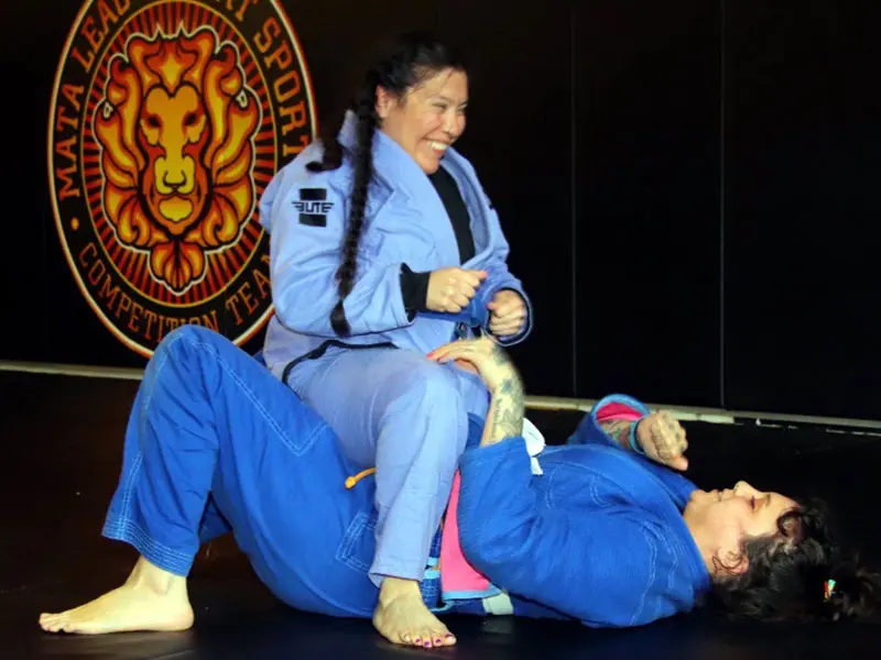 Adult BJJ students practicing self-defense techniques in Portland dojo